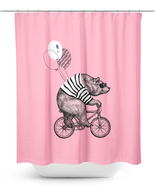 Bear riding bicycle on pink shower curtain